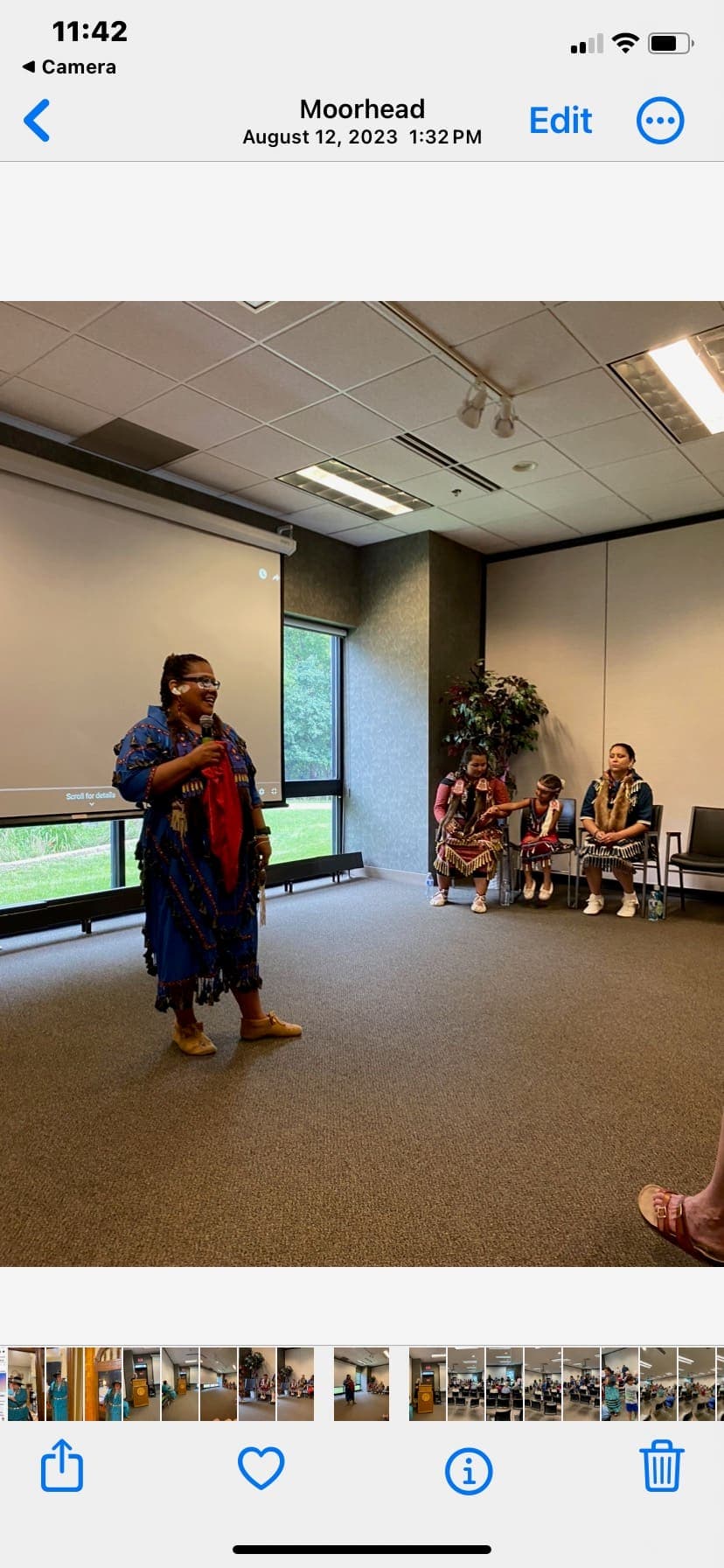 A community leader speaking to an audience at a CDR gathering
