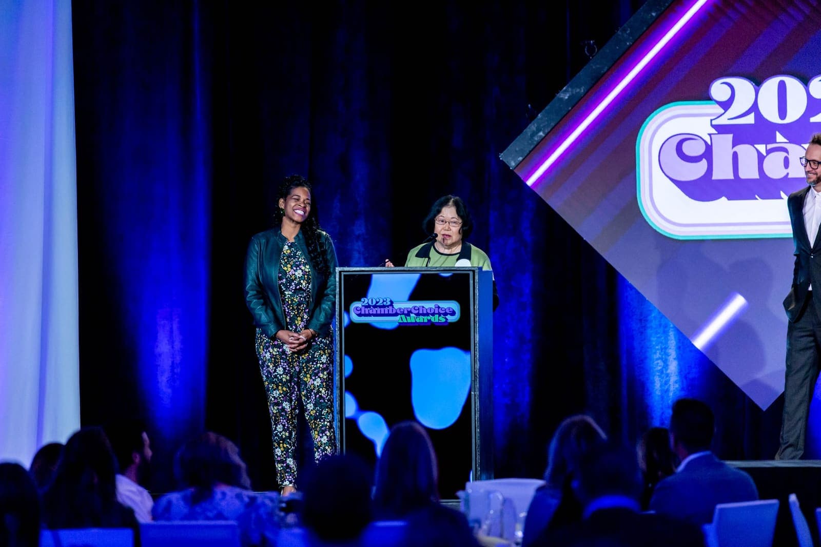CDR Executive Director Yoke-Sim Gunaratne speaking at the podium during the 2023 ChamberChoice Awards ceremony